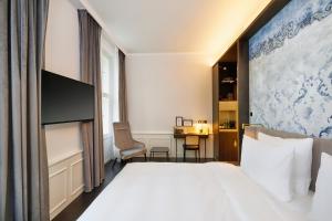 Voodi või voodid majutusasutuse HYPERION Hotel Salzburg toas