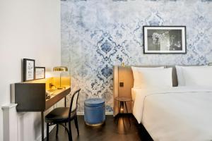 Voodi või voodid majutusasutuse HYPERION Hotel Salzburg toas