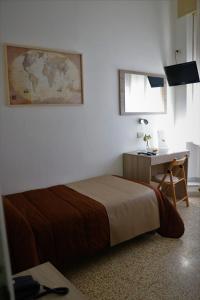 A bed or beds in a room at Hotel La Torre