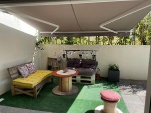 Кът за сядане в Appartement avec terrasse proche de Rennes