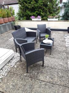 a group of chairs and tables on a patio at Hotel zur Altstadt in Celle