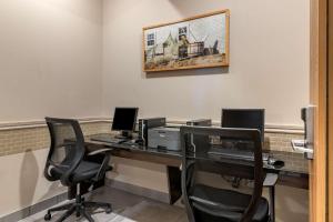 an office with a desk with two computers and a printer at Best Western Plus Bridgewater Hotel & Convention Centre in Bridgewater