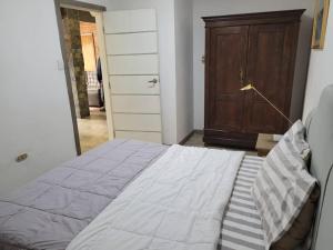 Llit o llits en una habitació de Apartamento tipo estudio