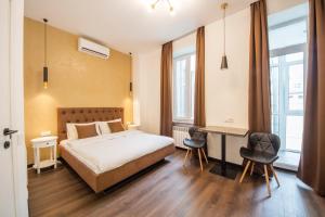 מיטה או מיטות בחדר ב-DayFlat Apartments Olimpiyska Area