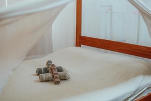 A bed or beds in a room at Ferra Resort Siargao