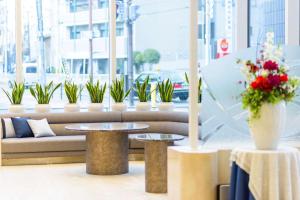 A seating area at SureStay Plus Hotel by Best Western Shin-Osaka