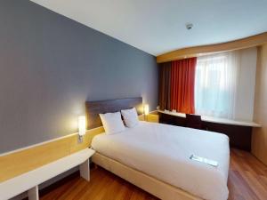 Кровать или кровати в номере Ibis Bratislava Centrum