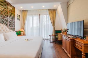 Krevet ili kreveti u jedinici u objektu Boutik Cham NhaTrang Hotel