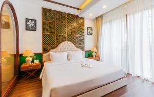 Krevet ili kreveti u jedinici u objektu Boutik Cham NhaTrang Hotel