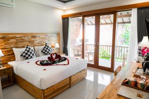 Ari Cottages Ubud房間的床