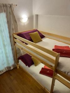 a pair of bunk beds in a room at Chalet Blanc "Le Flocon" in Courmayeur