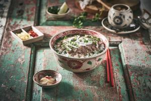 a bowl of food on a table with other dishes at Hotel Foret The Spa in Busan