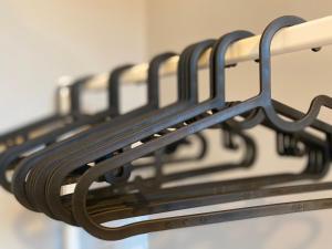 a row of towels hanging from a towel rack at Apartament Odrzanka in Gryfino