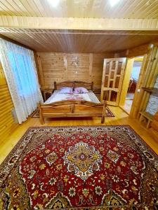 Tempat tidur dalam kamar di Садиба "Три Царі"