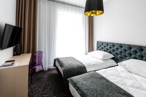 Katil atau katil-katil dalam bilik di Sleep in Hostel & Apartments Stary Rynek