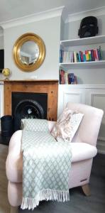 A seating area at Windsor Cottage: Cosy, Charming, Full of Character