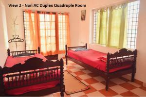 Tempat tidur dalam kamar di Sithara Homestay Fort Cochin