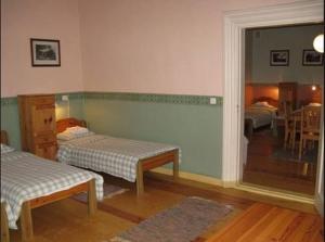 A bed or beds in a room at Sagadi Manor Hostel