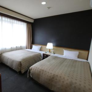 Hotel Aston Hotel Osaka Sakai में एक कमरे में एक या कई बेड