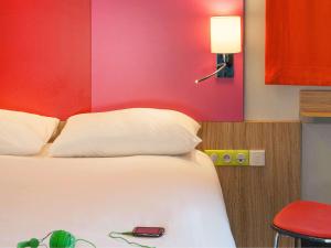 Rúm í herbergi á ibis Styles Romans-Valence Gare TGV