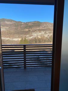 a view from a door of a balcony with a view at Agritur Verderame in Trento