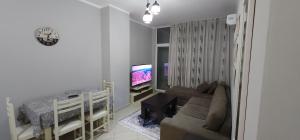 A television and/or entertainment centre at Pleasing Place with free parking on site in Tirana Komuna e Parisit