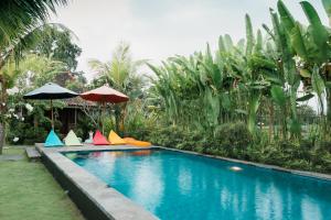 La pileta dentro o cerca de Nauna Villa Ubud