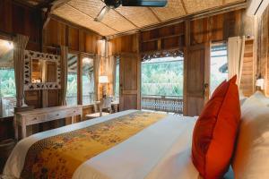 Una cama o camas en una habitación de Nauna Villa Ubud