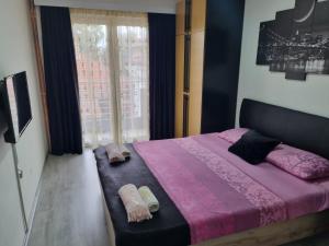 Giường trong phòng chung tại Family Apartmani Le