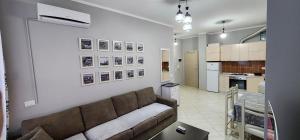 A kitchen or kitchenette at Pleasing Place with free parking on site in Tirana Komuna e Parisit