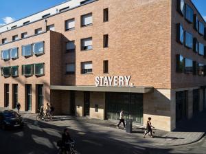 a rendering of a building with people walking in front of it at STAYERY Cologne Ehrenfeld in Cologne