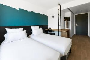 Krevet ili kreveti u jedinici u okviru objekta B&B HOTEL Geneva Airport