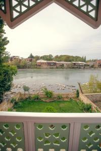 a view of a body of water from a balcony at Hotel Paradise Road in Kutaisi