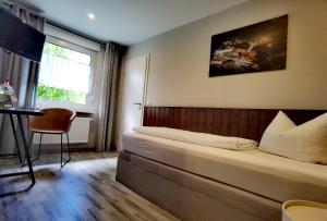 เตียงในห้องที่ Hotel Wandersleben - Erfurt