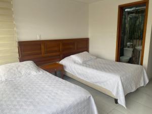 Cama ou camas em um quarto em HOTEL ZUHE