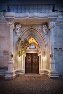 a large entrance to a building with a large wooden door at Sacred House in Urgup