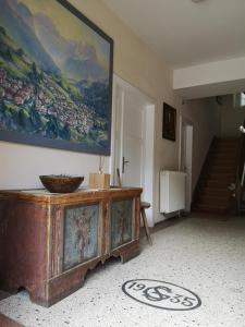 a living room with a large painting on the wall at Molignon - Ortisei - Val Gardena in Ortisei