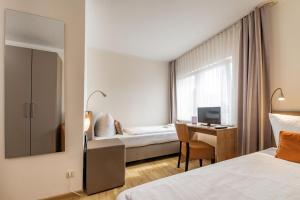 Krevet ili kreveti u jedinici u okviru objekta Hotel Bamberger Hof, garni