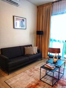 Khu vực ghế ngồi tại Staycationbyrieymona - 3BR Condo, CLIO 2, Putrajaya