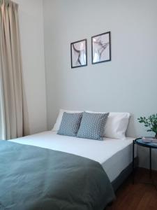 Giường trong phòng chung tại Staycationbyrieymona - 3BR Condo, CLIO 2, Putrajaya