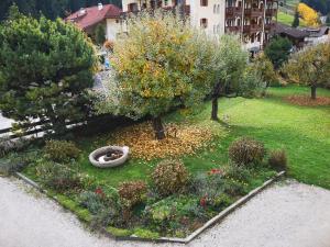 an aerial view of a garden with trees and flowers at Molignon - Ortisei - Val Gardena in Ortisei