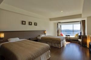 Krevet ili kreveti u jedinici u objektu Atami Seaside Spa & Resort