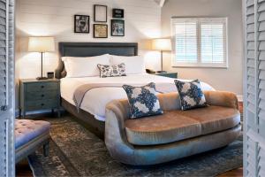 A bed or beds in a room at The Estate Yountville