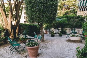 A garden outside Eveline Portosole Hotel