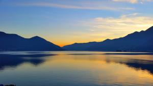 a view of a lake with mountains in the background at Hotel Tamaro in Ascona