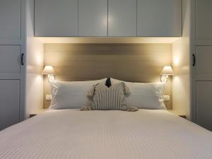 En eller flere senger på et rom på Il Cortiletto - Suites & Apartments