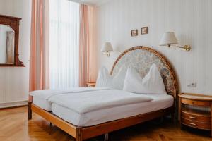 Una cama o camas en una habitación de Hotel Hammer