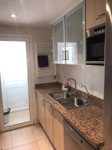 Kuhinja oz. manjša kuhinja v nastanitvi Apartament Catalunya, céntrico y con Parking