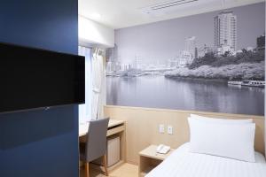 Posteľ alebo postele v izbe v ubytovaní Travelodge Honmachi Osaka