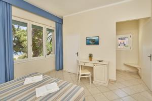 A bed or beds in a room at Hotel Villa Rodriguez